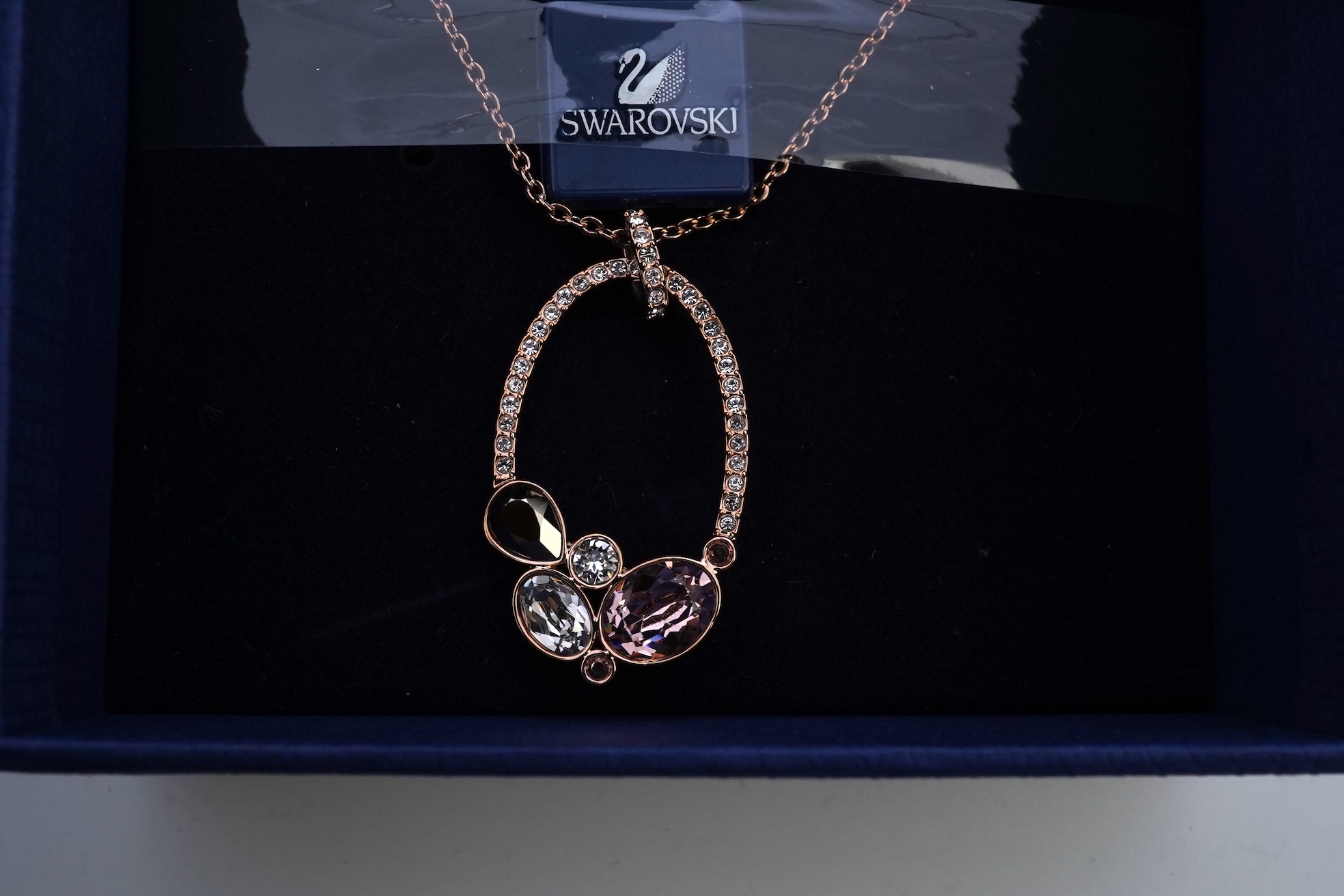 A Swarovski necklace and brooch.